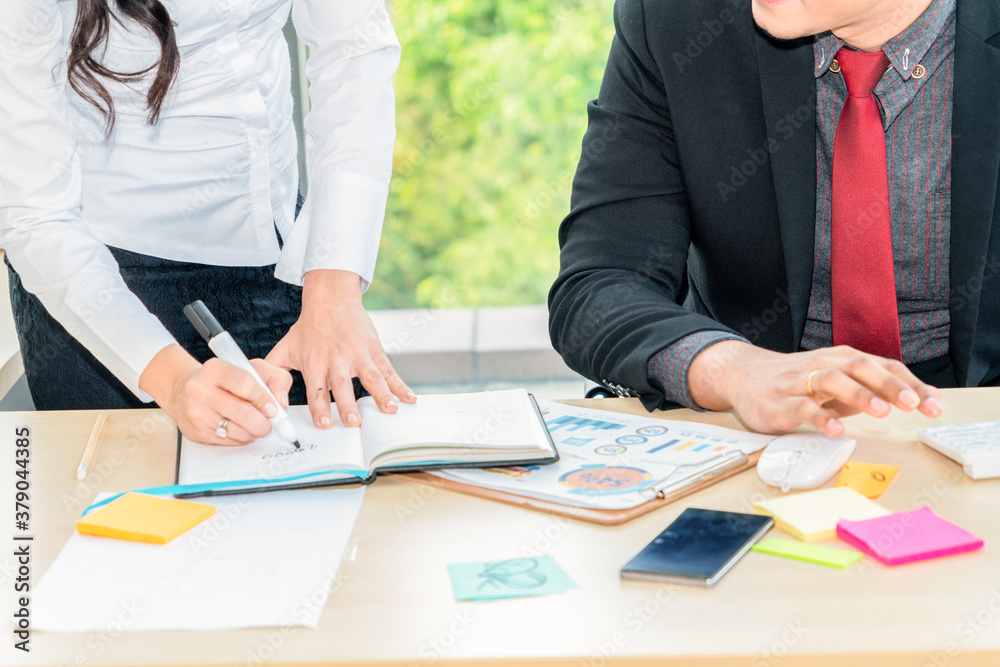 Two business people talk project strategy at office meeting room. Businessman discuss project planni