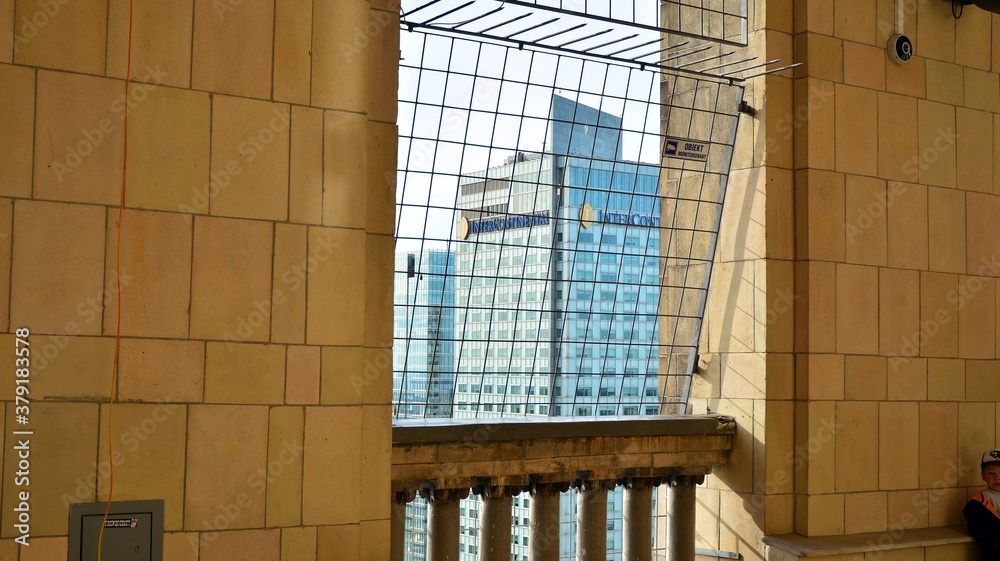 A lookout terrace on the 30th floor. People looking through barred windows on the terrace  located o