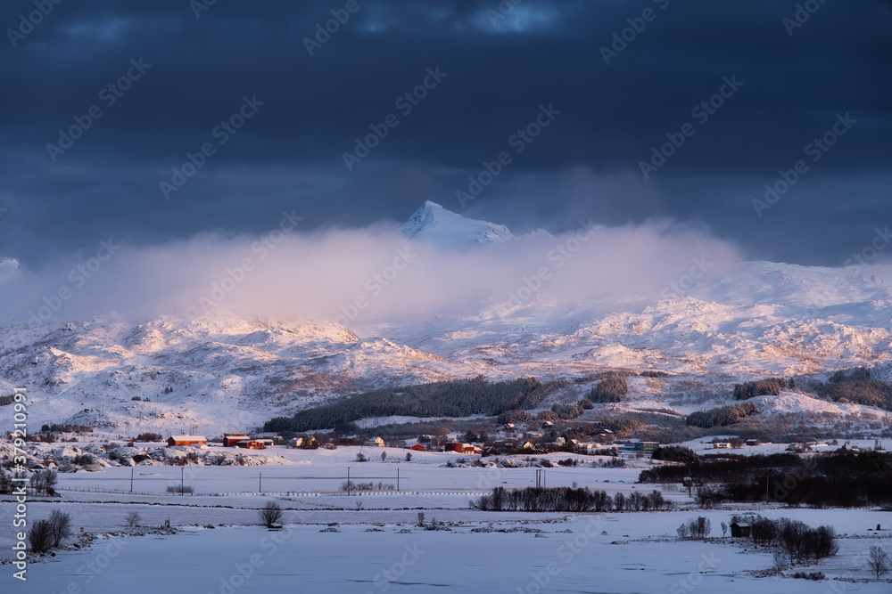 Lofoten islands, Norway. Mountains and clouds during sunset. Evening time. Winter landscape. Norway 