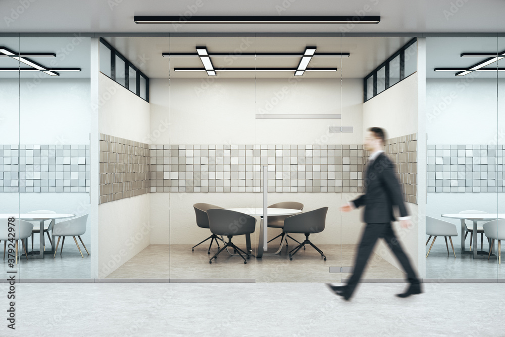 Businessman walking in meeting interior