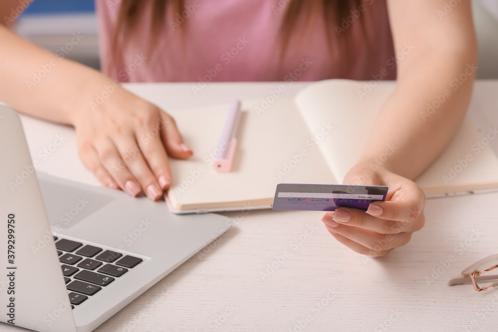 Young woman shopping online at home