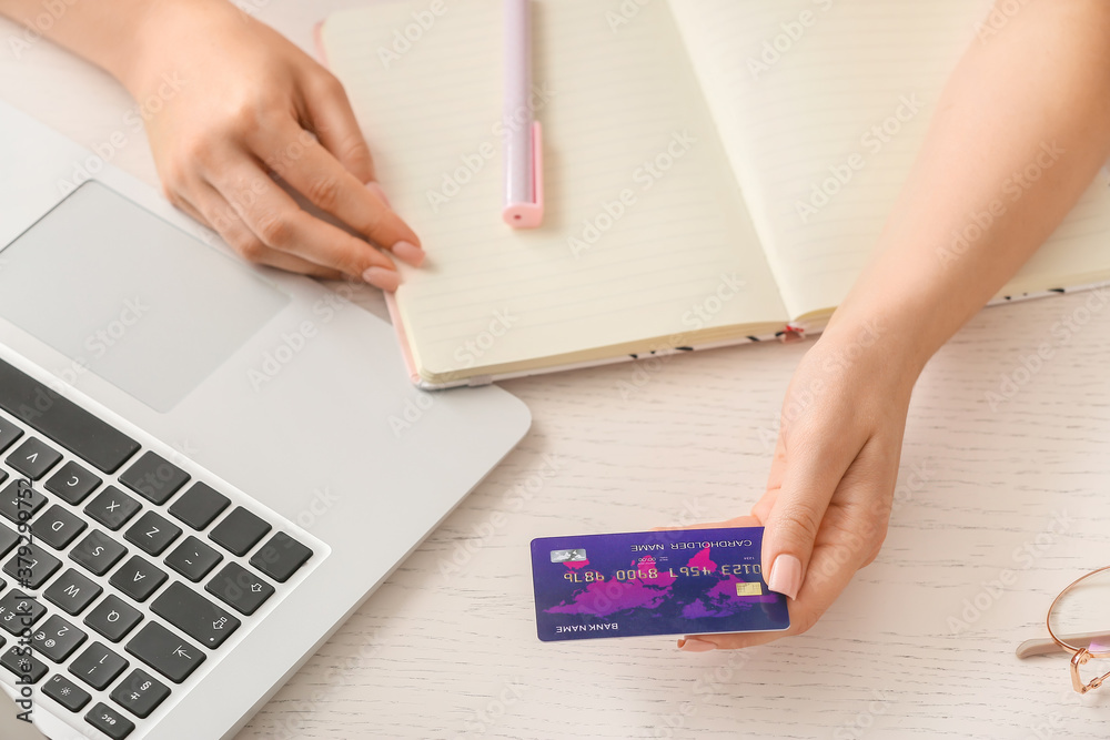 Young woman shopping online at home