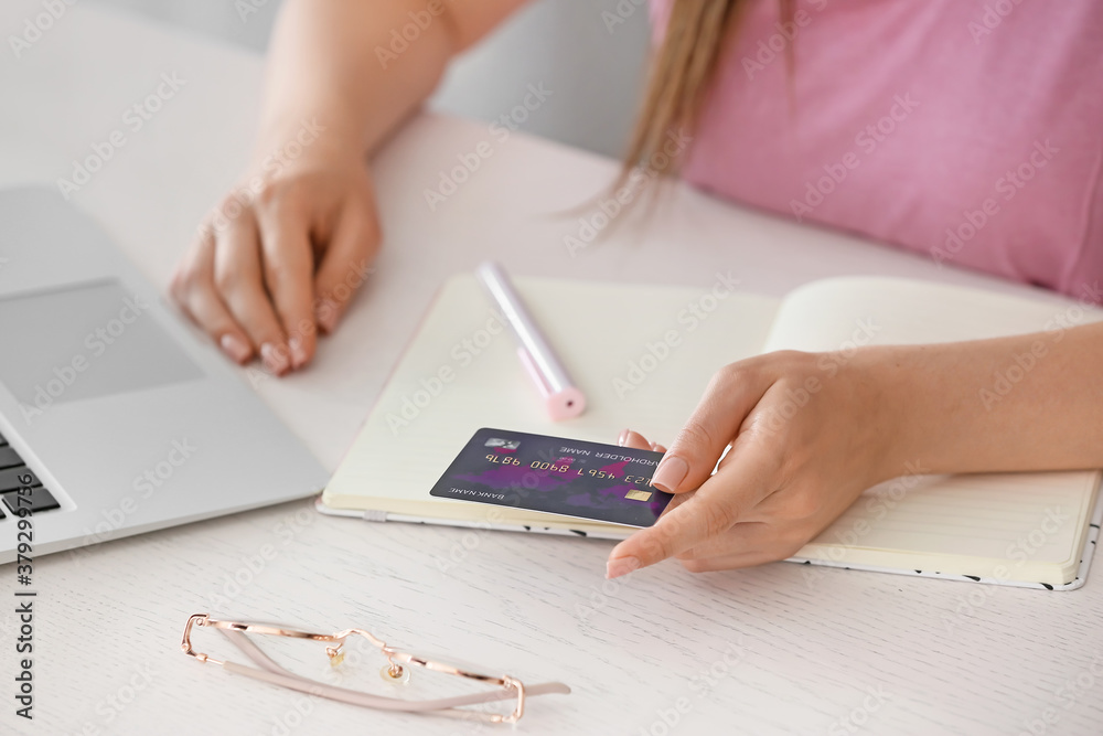 Young woman shopping online at home