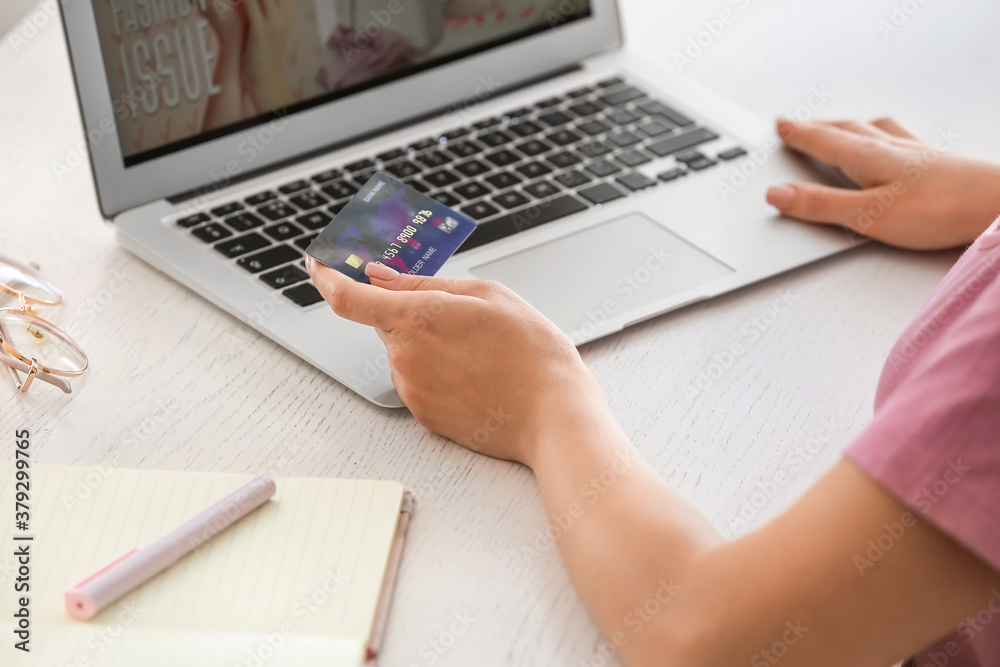 Young woman shopping online at home