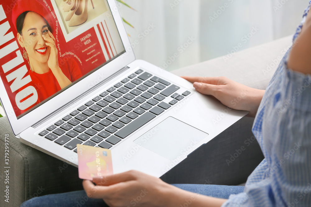 Young woman shopping online at home