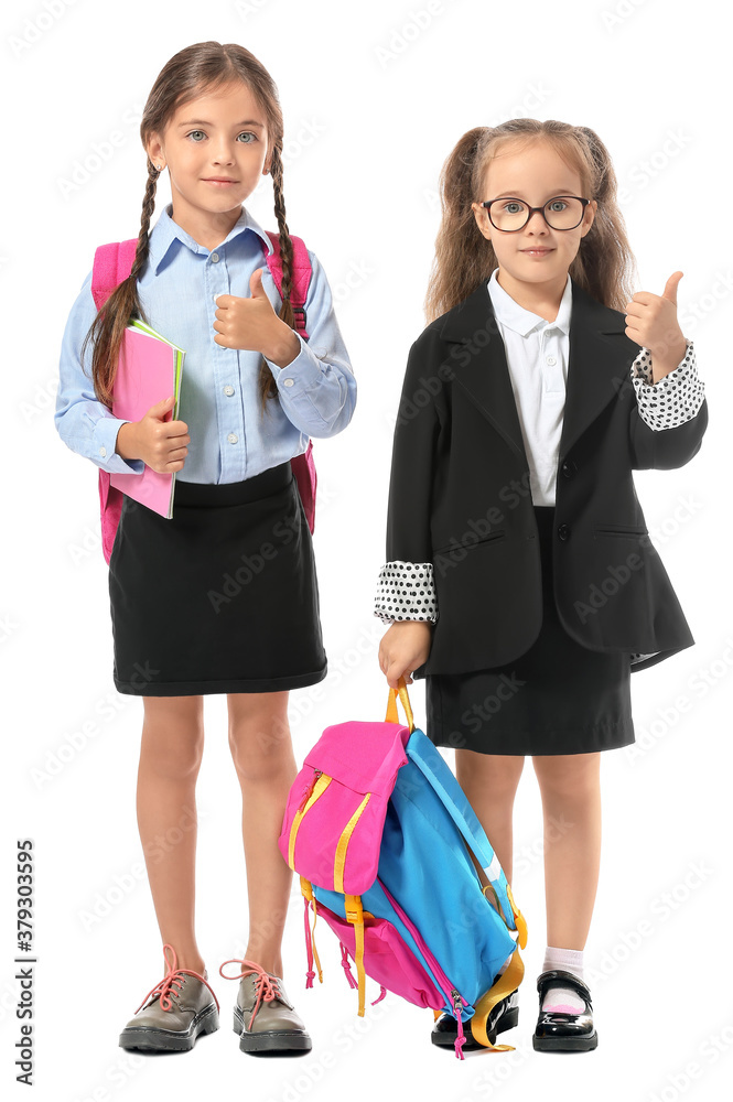 Little pupils showing thumb-up on white background