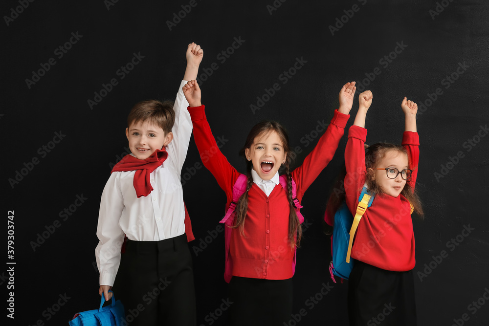 Happy little pupils on dark background