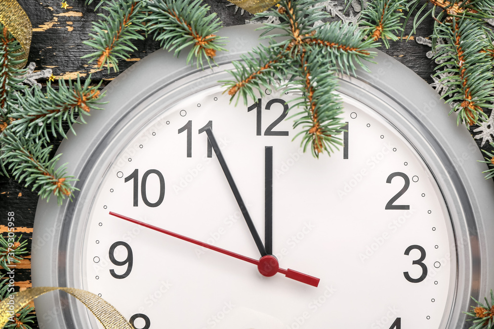 Clock and fir branches, closeup. Christmas time