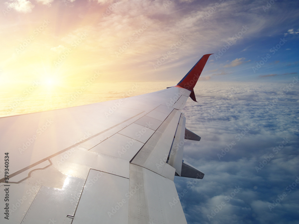 Wing of an airplane in the sunset