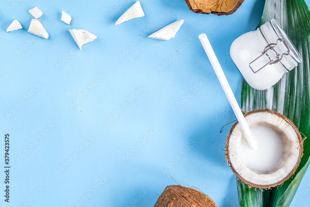 concept organic cosmetics with coconut on blue background top view