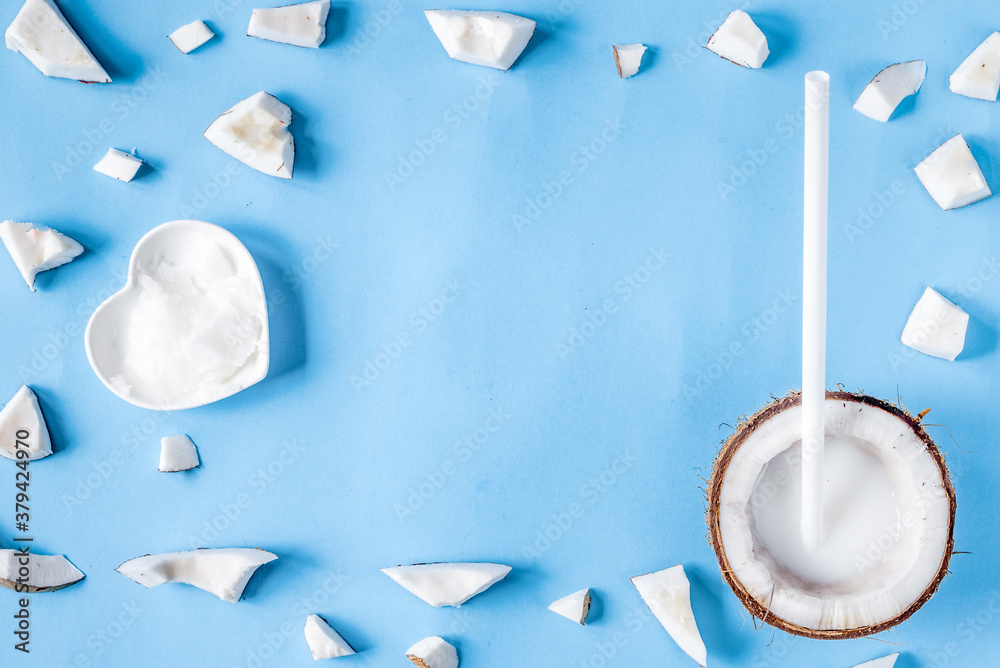 concept organic cosmetics with coconut on blue background top view