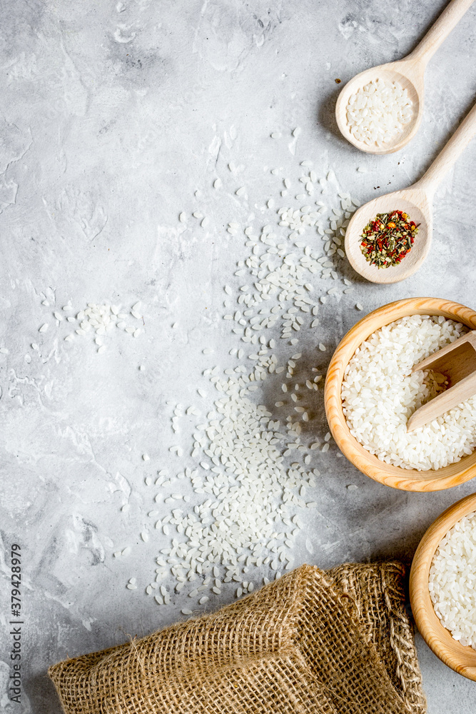 rice for paella on stone background top view mock up