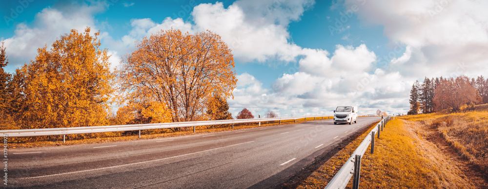 Road at falls on sunny day. Highway in autumn