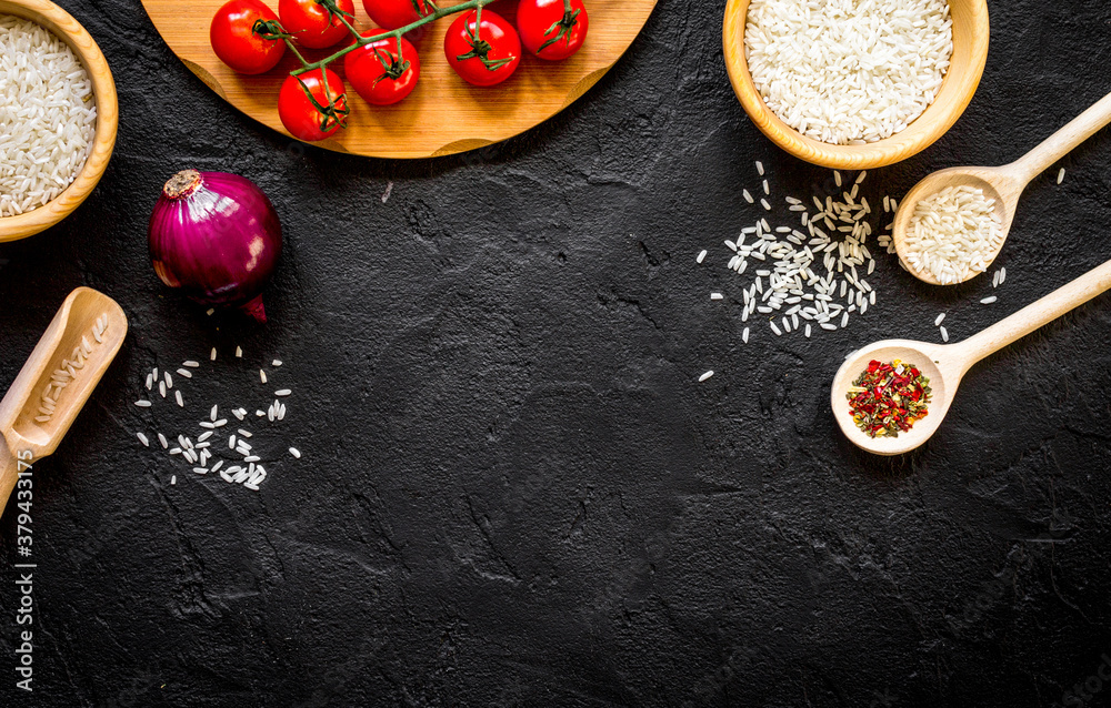 ingredients for paella on dark background top view