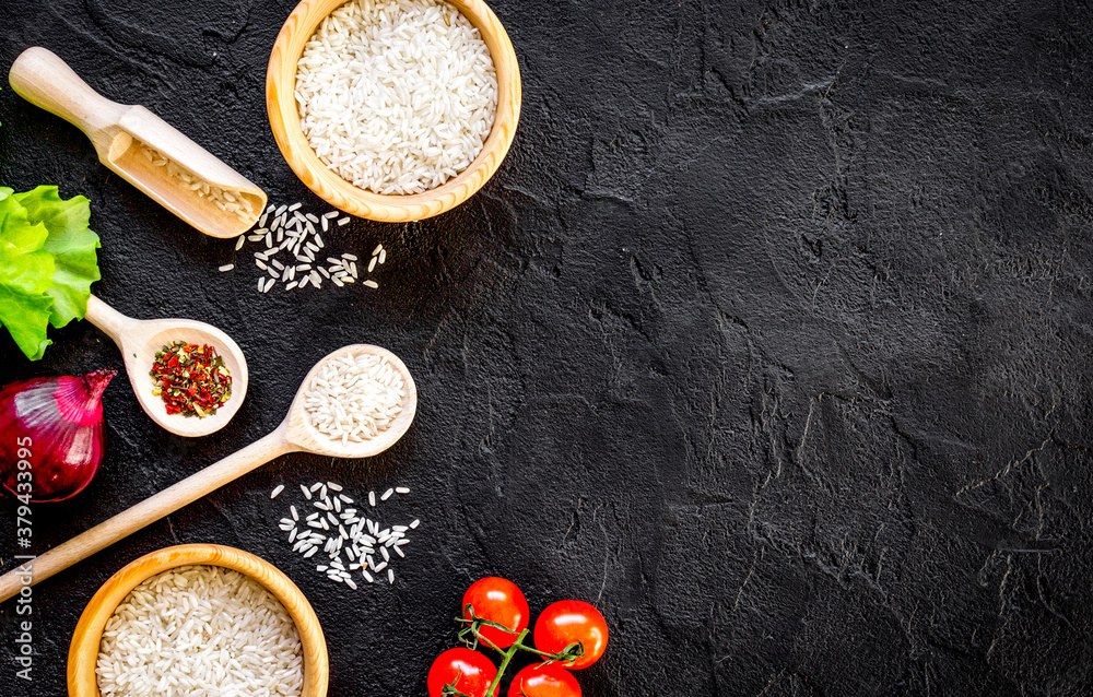 ingredients for paella on dark background top view