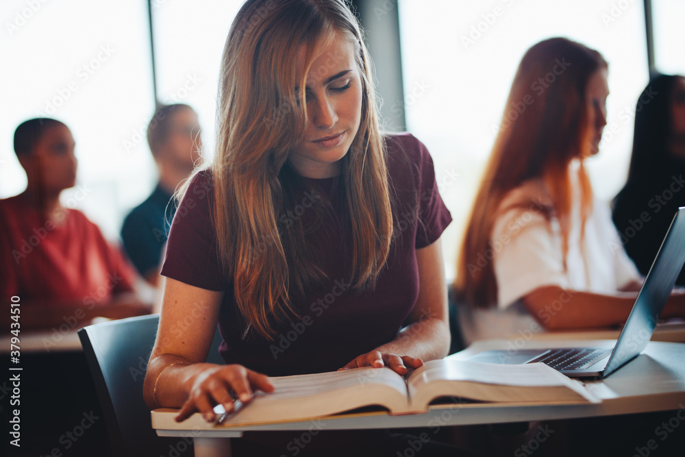 Girl studying in high school classroom