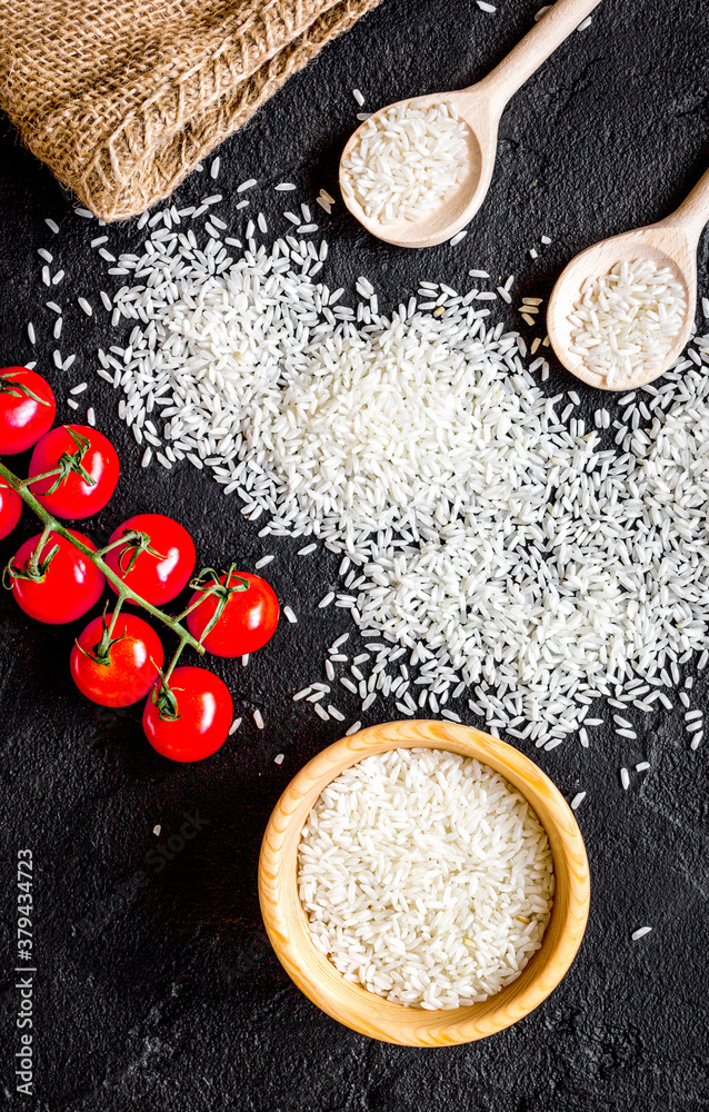 ingredients for paella on dark background top view