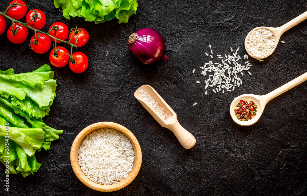 ingredients for paella on dark background top view