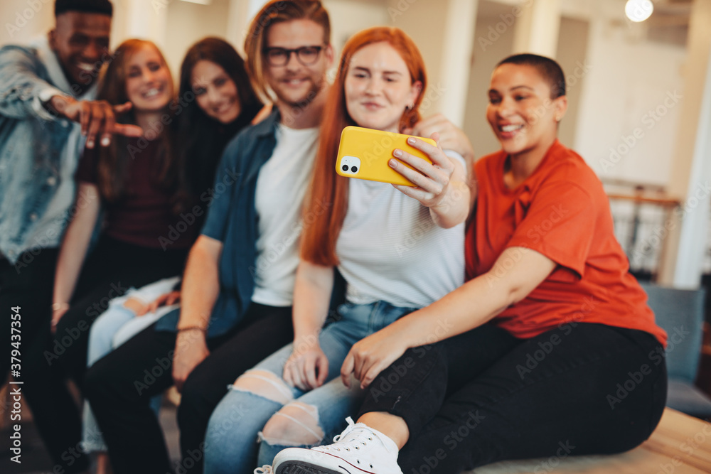 Students taking selfie in college campus