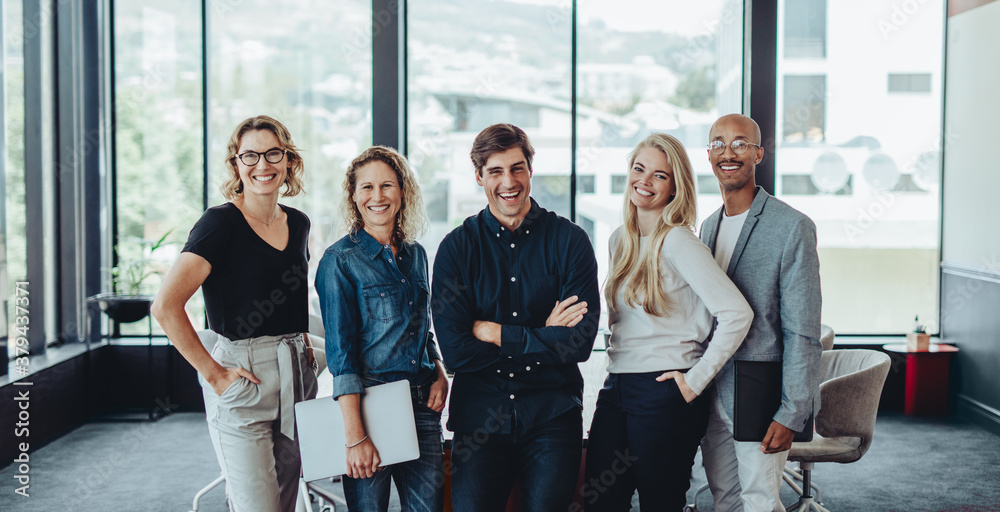 Multi-ethnic business team smiling in office