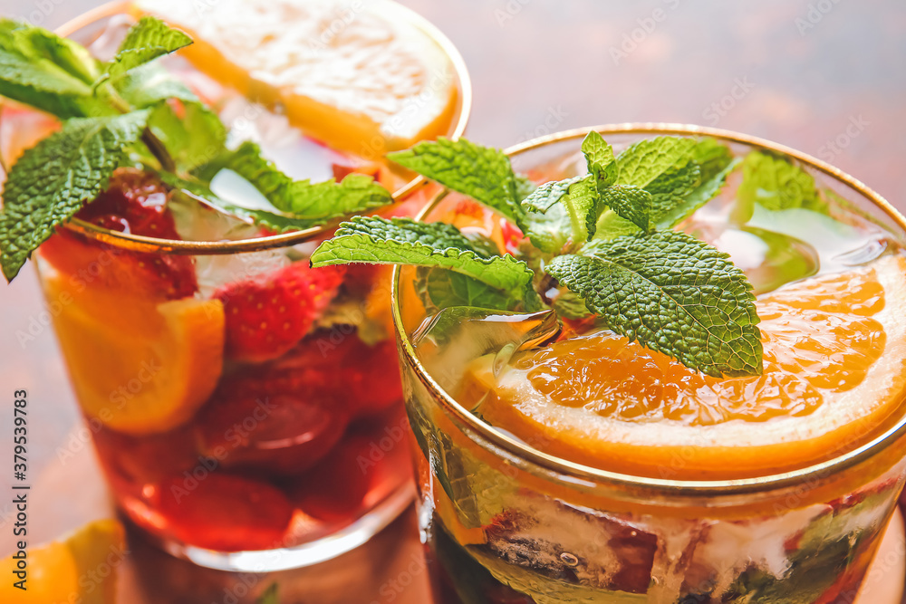 Glasses of fresh strawberry mojito on table, closeup