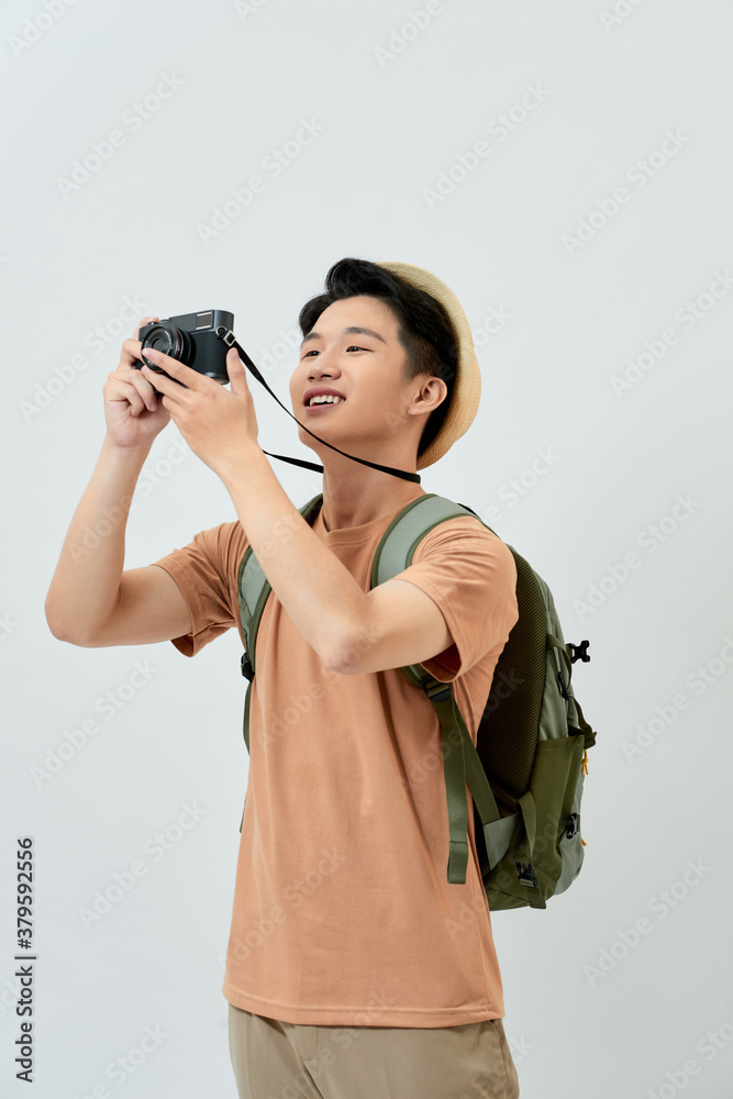 Full length portrait of happy tourist photographer man on white background. Travel blogger, tourist 