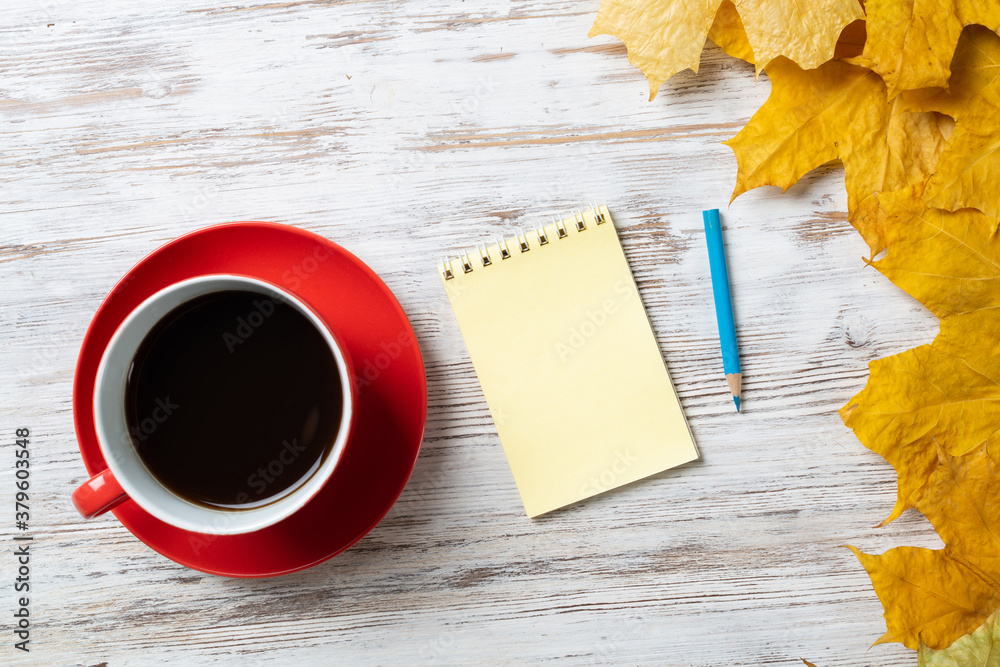 Flat lay autumn composition with cup of black tea