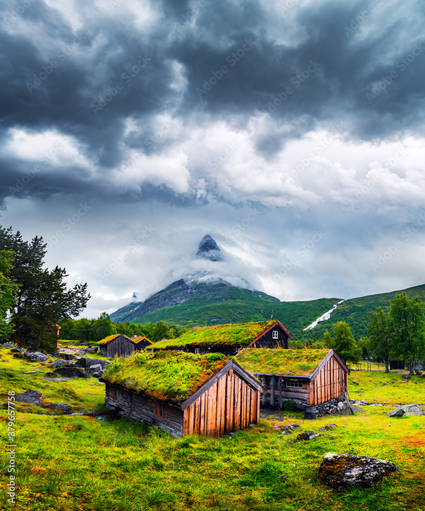 Typical norwegian old wooden houses with grass roofs in Innerdalen - Norways most beautiful mountai