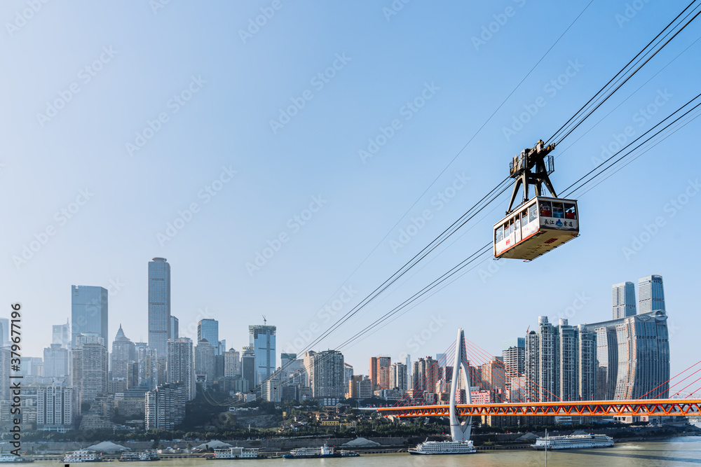 Scenery of high-rise buildings and Yangtze River cableway in Chongqing, China
