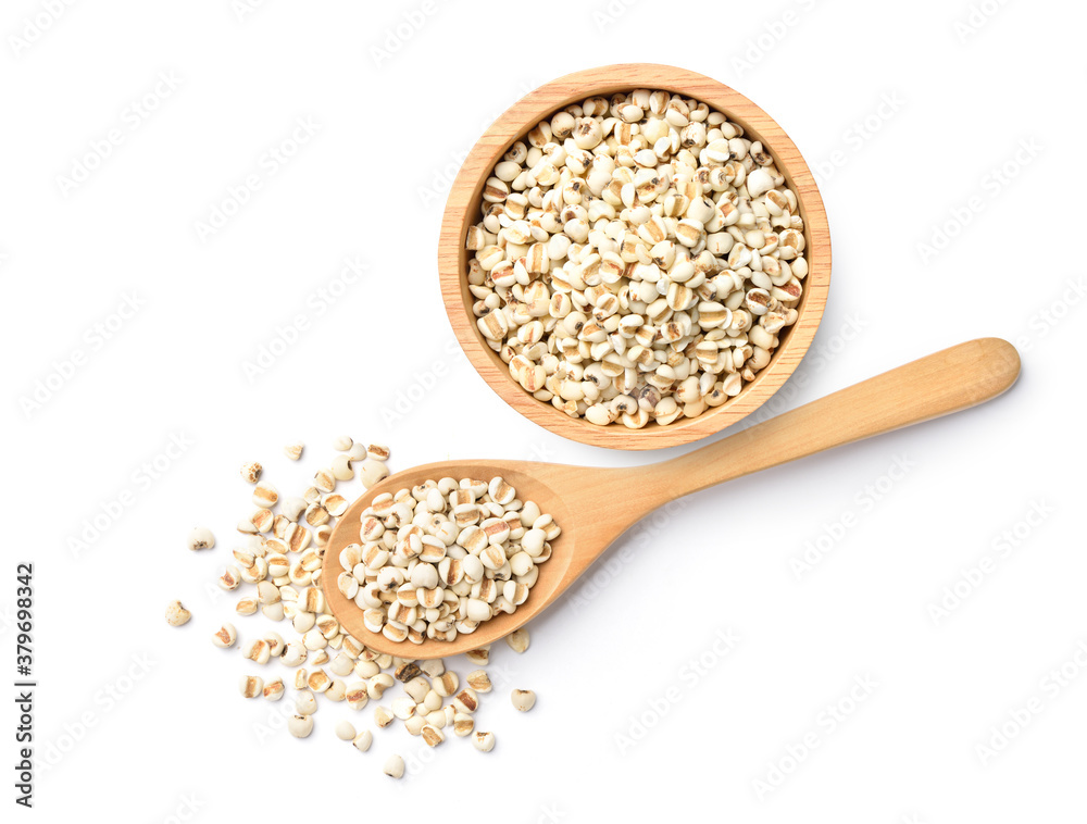 Flat lay (top view) of Jobs tears  in wooden bowl and spoon on white background.