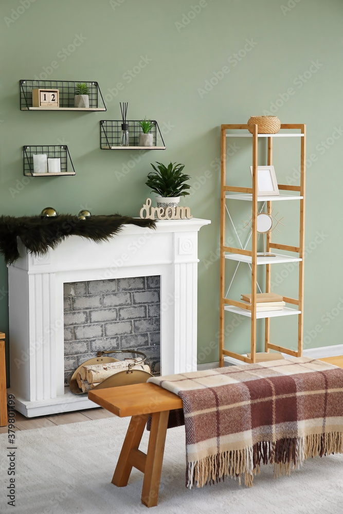 Modern fireplace with shelves in interior of room