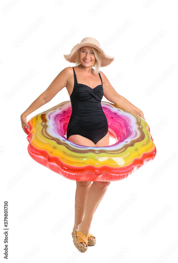 Mature woman with inflatable ring on white background