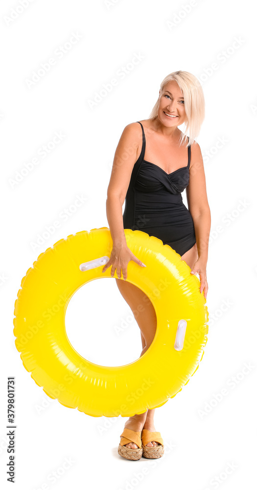 Mature woman with inflatable ring on white background