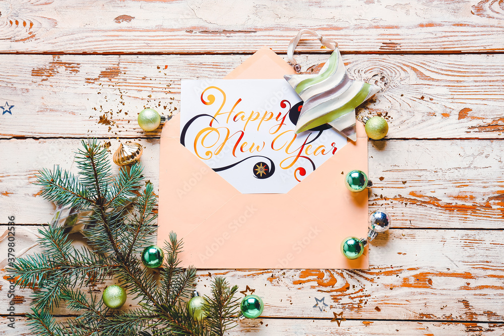 Beautiful composition with New Year greeting card on wooden background