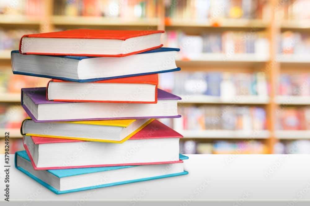 Stack of colorful books collection on the desk