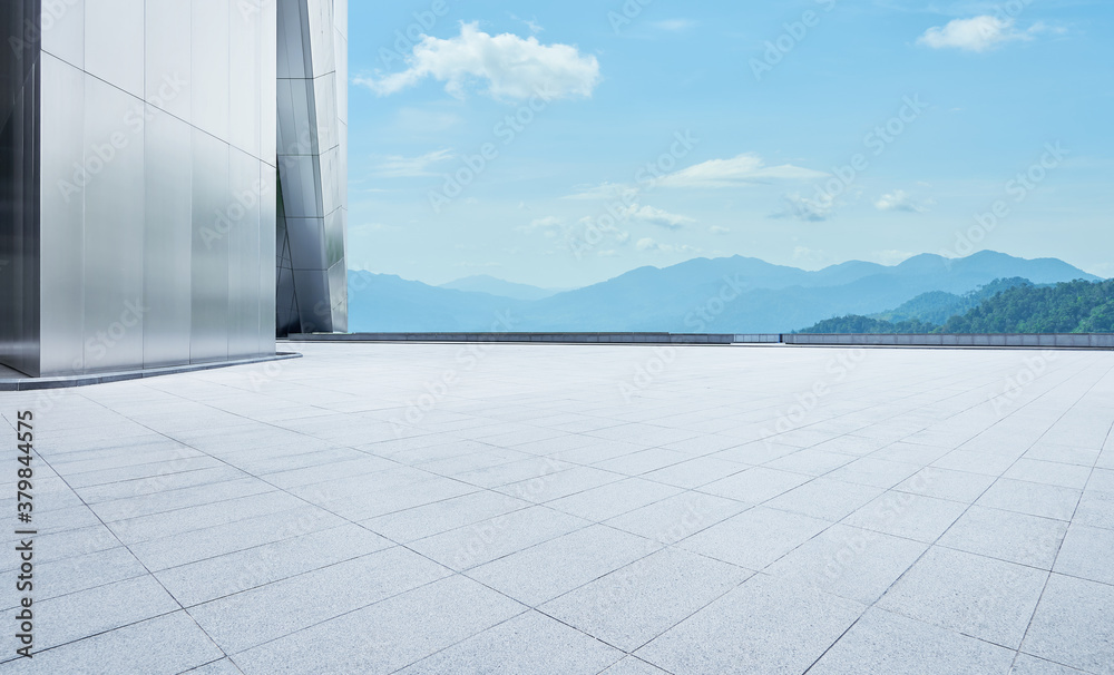 Empty concrete tiles floor with modern architecture and beautiful landscape