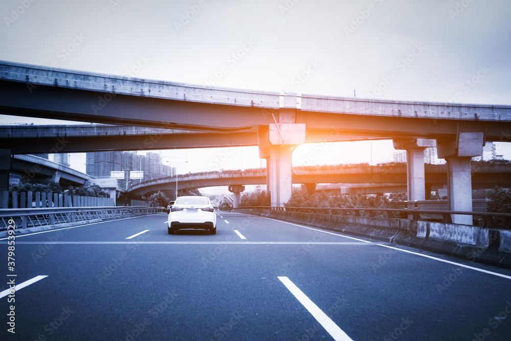 Highway overpass modern city skyline background .