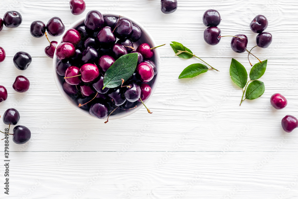 Sweet red cherries with leaves, flat lay, top view