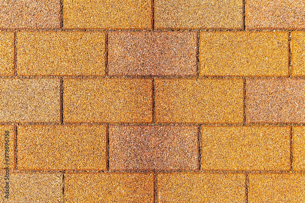 Vintage yellow cobblestone pavement pattern and background