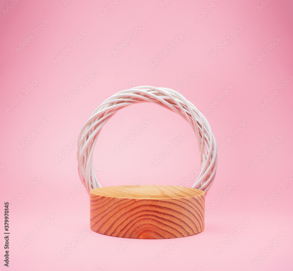 wooden podium stage with white wreath from vine isolated on pink background for use show product con