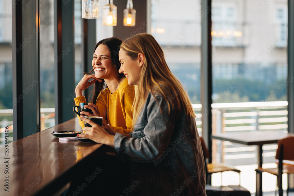 Women friends meeting for a coffee on a weekend