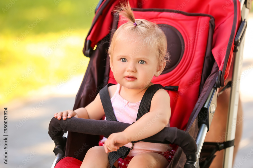 Cute baby in stroller outdoors