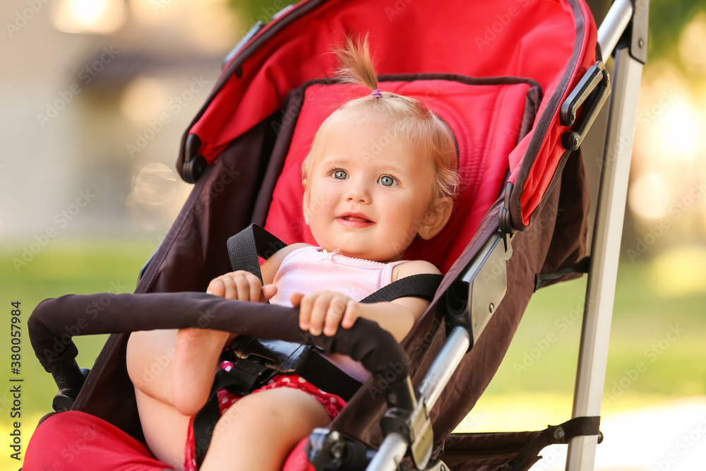 Cute baby in stroller outdoors