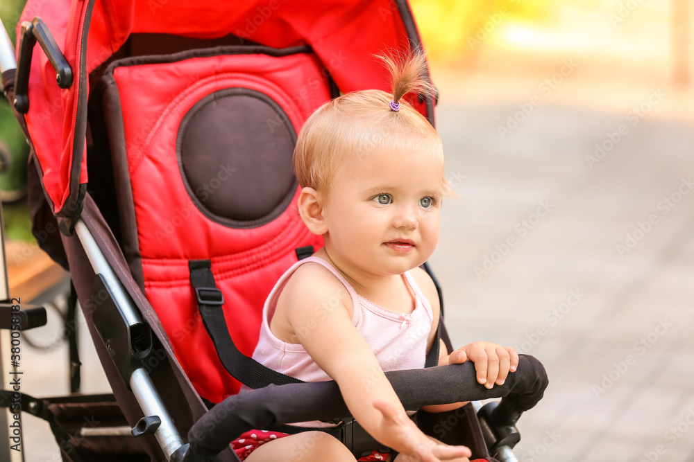 Cute baby in stroller outdoors