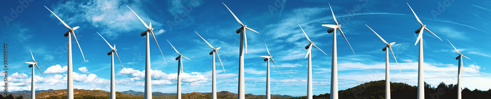 Renewable energy and wind turbines. Wind mills farm and sunset landscape.