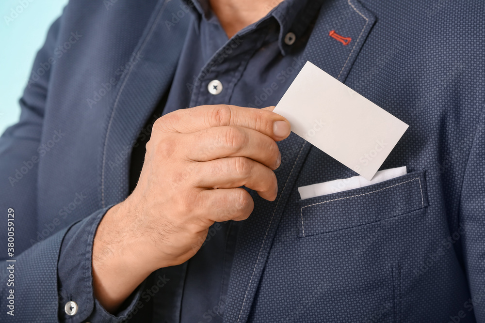 Man with blank business card, closeup