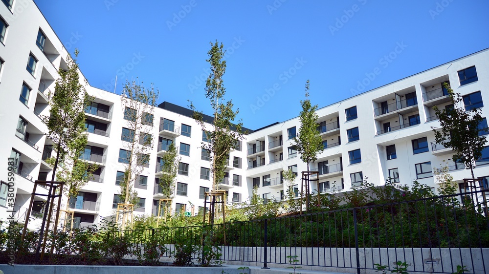 Multistoried modern, new and stylish living block of flats. Newly built apartment building.