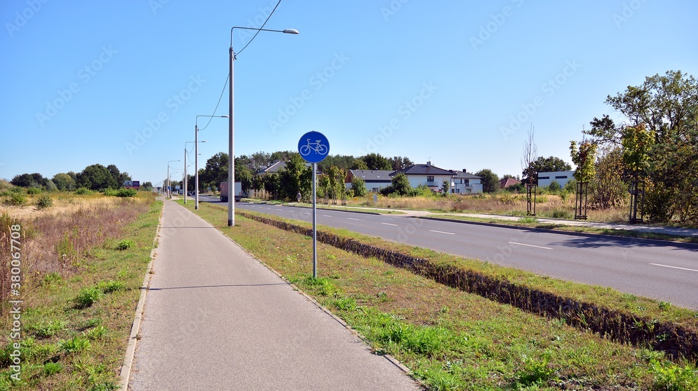 person walking on the road