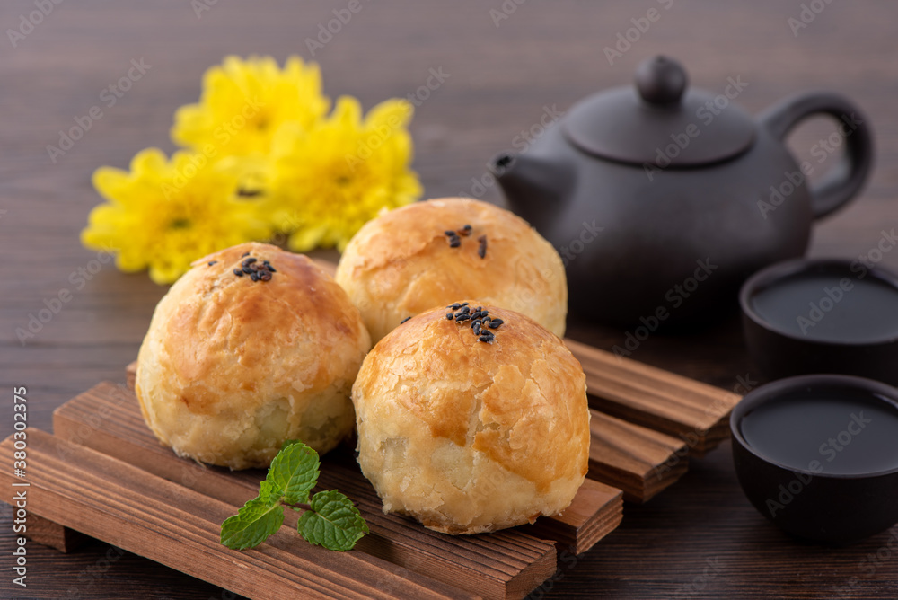 Moon cake yolk pastry, mooncake for Mid-Autumn Festival holiday, top view design concept on dark woo