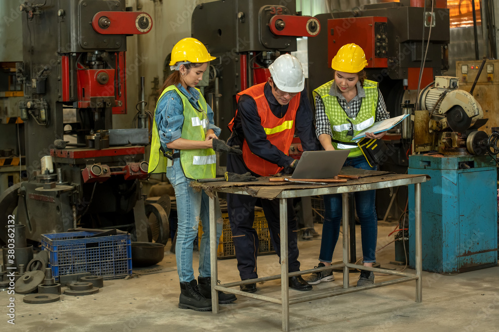 Team engineering working at industrial factory.